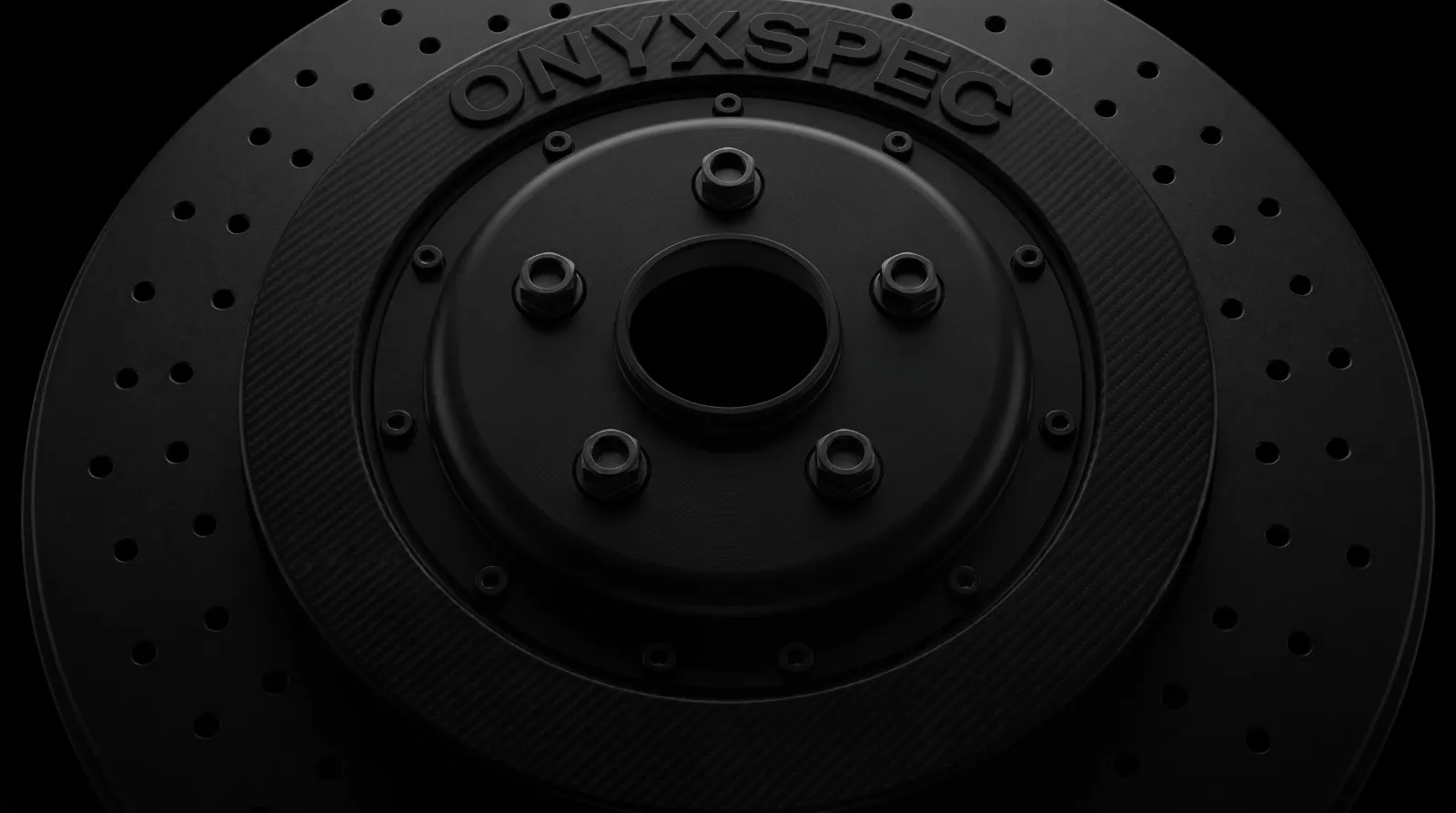 Black carbon-ceramic brake rotor with ONYXSPEC moulded into the hat, on a black studio background
